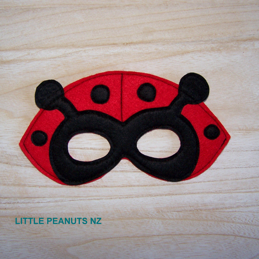 Red felt ladybug mask with black stitched spots